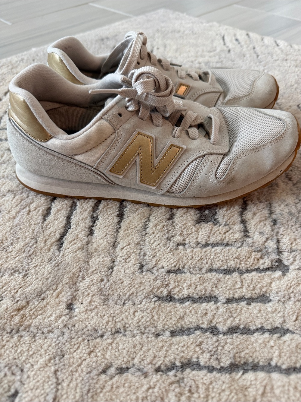 New Balance 373 Light Beige Sneakers with Gold Accents